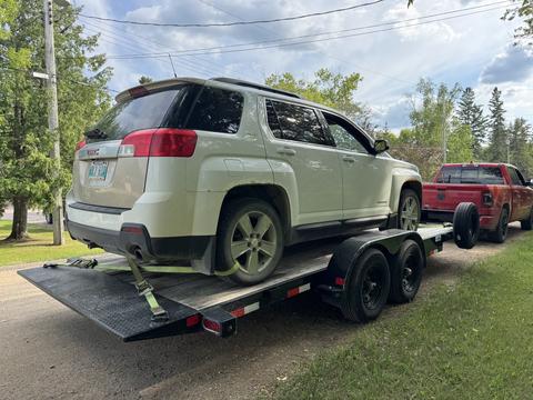 CashForCars Canada | Scrap Car Removal of GMC Terrain on Trailer