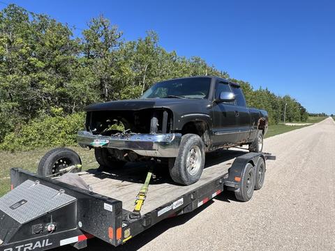 CashForCars Canada | Junk Car Removal of a Black Pickup Truck for Scrap Metal Recycling