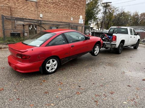 CashForCars Canada | Junk Car Removal of Red Chevy Cavalier for Recycling